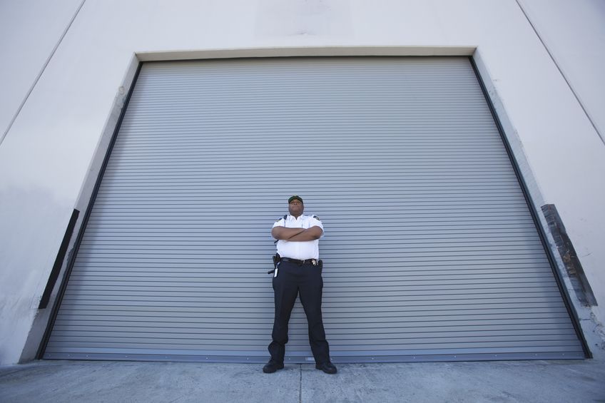 security guard protects warehouse entrance