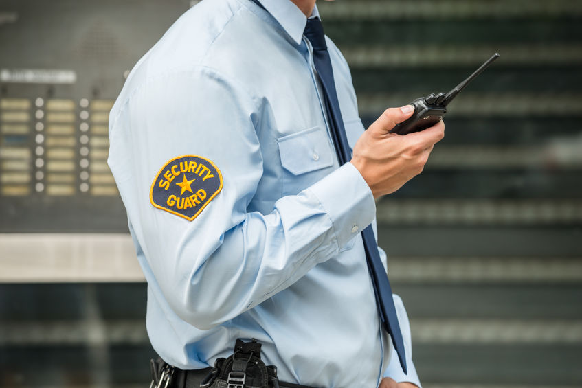 security guard using walkie talkie at school 